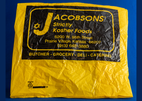 yellow plastic bag with a black design labeling the bag as Jacobsons Strictly Kosher Foods